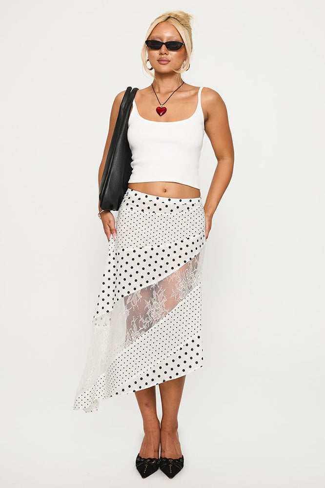 Asymmetrischer Midirock mit Punktemuster und Spitze