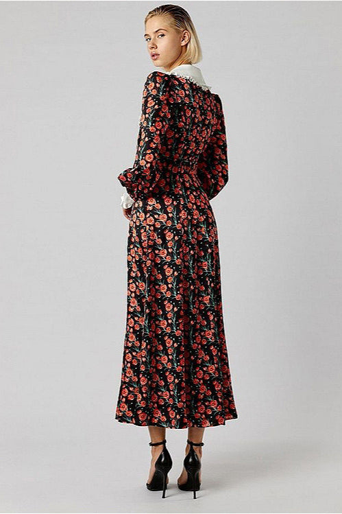 Kleid mit Raffung und Blumenmuster